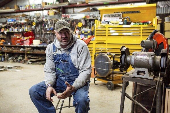 Jared Bossly speaks about his experiences with Summit Carbon Solutions employees on his ranch in Mansfield, S.D., on Tuesday, March 11, 2025. (AP Photo/Nicole Neri)