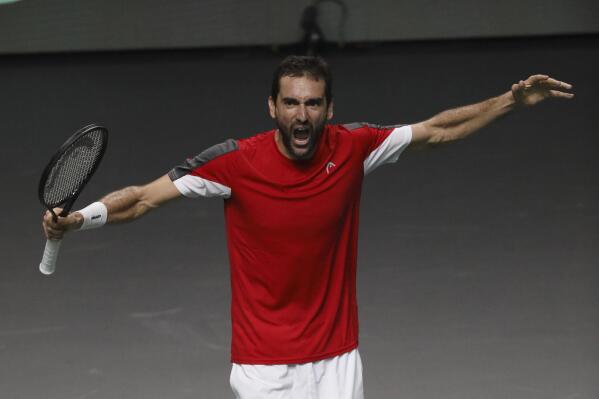 Croatia's Marin Cilic celebrates after defeating Spain's Pablo Carreno during a Davis Cup quarter-final tennis match between Croatia and Spain in Malaga, Spain, Wednesday, Nov. 23, 2022. (AP Photo/Joan Monfort)