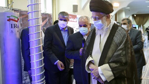 FILE - In this photo released by the office of the Iranian supreme leader, Supreme Leader Ayatollah Ali Khamenei, right, visits an exhibition of the country's nuclear achievements, at his office compound in Tehran, Iran, Sunday, June 11, 2023. A U.S. intelligence assessment says Iran is not pursuing nuclear weapons at the moment but has ramped up activities that could help it develop them. The assessment from the Office of the Director of National Intelligence released Monday, July 10, says Iran has moved to increase its capacity to produce an atomic bomb since 2020 but has stopped short of that so far. (Office of the Iranian Supreme Leader, Via AP, File)