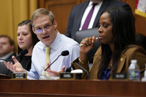 Chairman Jim Jordan, R-Ohio, left, speaks as Del. Stacey Plaskett, D-Virgin Islands, the ranking member, right, listens, during a House Judiciary subcommittee hearing on what Republicans say is the politicization of the FBI and Justice Department and attacks on American civil liberties on Capitol Hill, Thursday, Feb. 9, 2023, in Washington. (AP Photo/Carolyn Kaster)