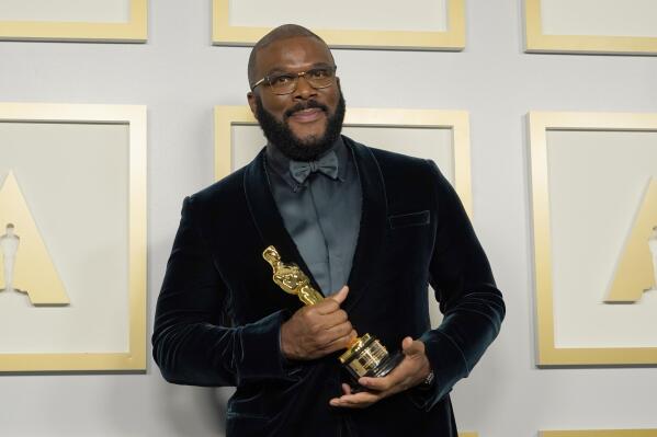 Tyler Perry, winner of the Jean Hersholt Humanitarian Award, poses in the press room at the Oscars on Sunday, April 25, 2021, at Union Station in Los Angeles. (AP Photo/Chris Pizzello, Pool)