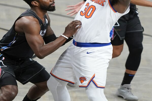 Brooklyn Nets' Jeff Green, left, defends New York Knicks' Julius Randle (30) during the second half of an NBA basketball game Monday, April 5, 2021, in New York. (AP Photo/Frank Franklin II)