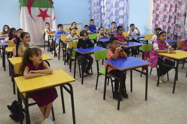 Schoolchildren attend a class Tuesday, Sept.19, 2023 in the Ben Omar district of Algiers. More tan 11 millions student are back to school Tuesday. (AP Photo/Str)