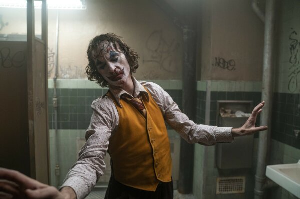 This image released by Warner Bros. Pictures shows Joaquin Phoenix in a scene from "Joker."  The film was named one of the American Film Institute's top 10 movies of the year. (Niko Tavernise/Warner Bros. Pictures via AP)