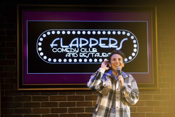Kaycee Conlee performs during Stand Up For Climate, a comedy show at Flappers Comedy on Thursday, March 20, 2025, in Burbank, Calif. (AP Photo/Ethan Swope)