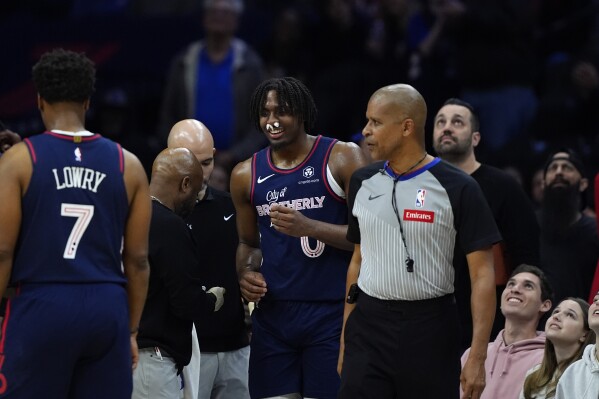 Philadelphia 76ers' Tyrese Maxey (0) reacts after being fouled by Charlotte Hornets' Brandon Miller during the first half of an NBA basketball game, Saturday, March 16, 2024, in Philadelphia. (AP Photo/Matt Slocum)