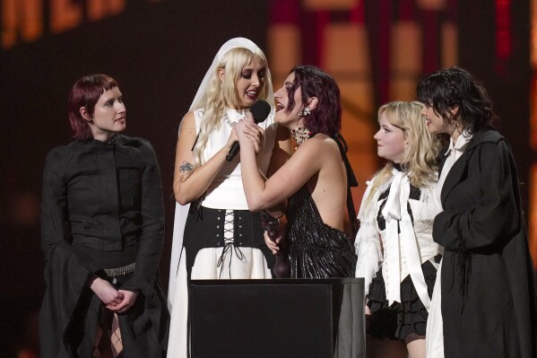 Lizzie Mayland, from left, Georgia Davies, Aurora Nishevci, Emily Roberts and Abigail Morris, from the group 'The Last Dinner Party', accept the best new artist award during the Brit Awards 2025 in London, Saturday, March.1, 2025. (Photo by Scott A Garfitt/Invision/AP)
