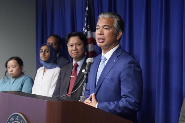 California Attorney General Rob Bonta, right, discusses the rise in hate crimes in California, at a news conference in Sacramento, Calif., Tuesday, June 28, 2022. Bonta said hate crimes in 2021 shot up 33% to nearly 1,800 reported incidents. That is the sixth highest tally on record and the highest since after the 9/11 terrorist attack in 2001. (AP Photo/Rich Pedroncelli)