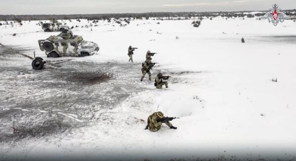 In this handout photo taken from video released by Russian Defense Ministry Press Service on Wednesday, Dec. 28, 2022, Russian soldiers take part in drills at an unspecified location in Belarus. After Russia invaded Ukraine, guerrillas from Belarus began carrying out acts of sabotage on their country's railways, including blowing up track equipment to paralyse the rails that Russian forces used to get troops and weapons into Ukraine. (Russian Defense Ministry Press Service via AP)