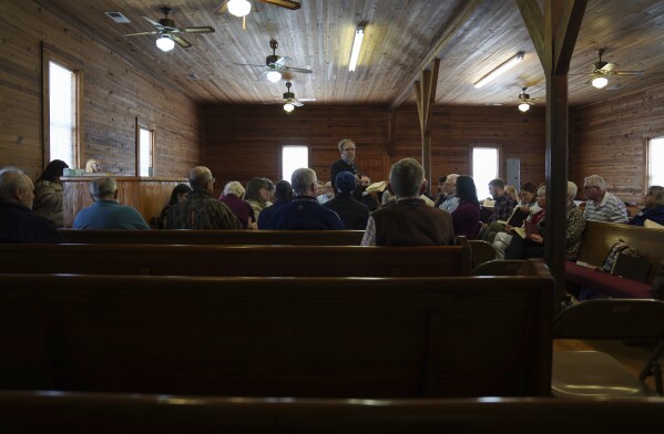 Matt Hinton, a shape-note singer, leads a song at a Sacred Harp singing event held at Holly Springs Primitive Baptist Church in Bremen, Ga., on Saturday, March 22, 2025. (AP Photo/Jessie Wardarski)