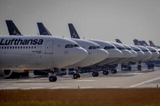File- File picture taken June 3, 2020 shows Lufthansa aircrafts parking on a runway at the airport in Frankfurt, Germany. Lufthansa said Friday it has repaid all the German government aid it received last year to help the airline group through the coronavirus pandemic. (AP Photo/Michael Probst,file)
