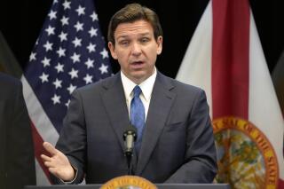 FILE - Florida Gov. Ron DeSantis speaks at a news conference at the Reedy Creek Administration Building Monday, April 17, 2023, in Lake Buena Vista, Fla. DeSantis has yet to enter the 2024 presidential race, but former President Donald Trump is aiming to drum up support in the Florida governor's backyard, securing endorsements already from about one-third of the Republicans in the state's congressional delegation. (AP Photo/John Raoux, File)