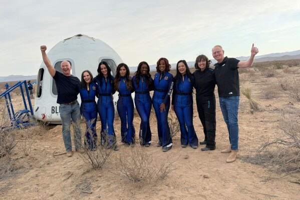 This image provided by Blue Origin shows from left: Jeff Bezos, Kerianne Flynn, Katy Perry, Lauren Sanchez, Aisha Bowe, Gayle King, Amanda Nguyen, Sarah Knights, director of Blue Origin's astronaut office, and Blue Origin CEO Dave Limp. (Blue Origin via AP)