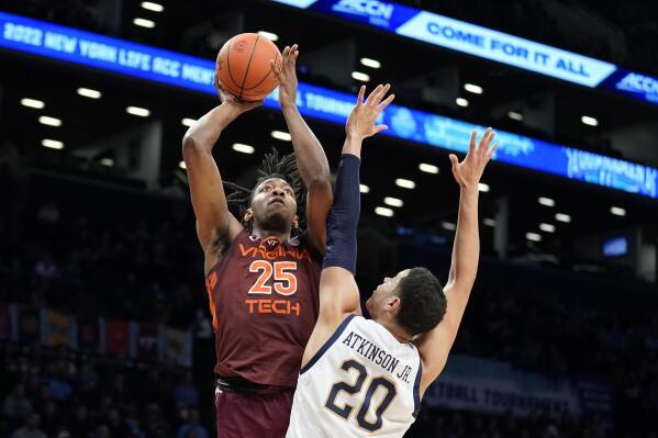 FILE - Virginia Tech's Justyn Mutts (25) shoots against Notre Dame's Paul Atkinson Jr. (20) during the first half of an NCAA college basketball game during quarterfinals of the Atlantic Coast Conference men's tournament March 10, 2022, in New York. Mutts was the Hokies' top rebounder and second-leading scorer last season. (AP Photo/John Minchillo, File)