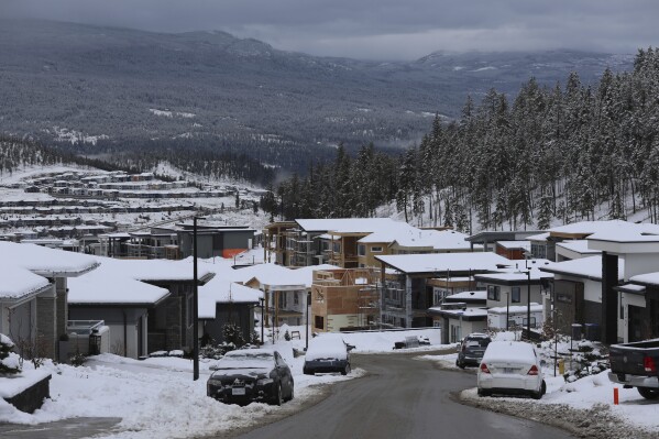 Urban development in the Black Mountain community is visible in Kelowna, British Columbia, on Feb. 12, 2024. The community is near a key wildlife corridor that ribbons around the Okanagan Mountain Provincial Park and Kalamalka Lake Provincial Park. (Aaron Hemens/IndigiNews via AP)