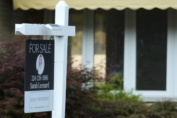 A "For Sale" sign is displayed in front of a home in Des Plaines, Ill., Monday, Aug. 26, 2024. (AP Photo/Nam Y. Huh, File)