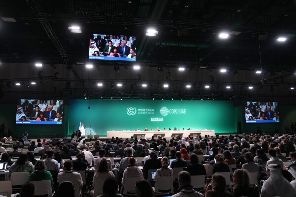 Britain's Minister for Climate Graham Stuart speaks during a plenary session at the COP28 U.N. Climate Summit, Wednesday, Dec. 13, 2023, in Dubai, United Arab Emirates. (AP Photo/Kamran Jebreili)