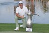 Rory McIlroy of Northern Ireland poses with his trophy after he won the final round of the Hero Dubai Desert Classic golf tournament, in Dubai, United Arab Emirates, Sunday, Jan. 21, 2024. (AP Photo/Kamran Jebreili)