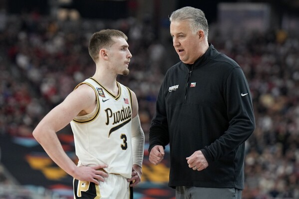 Purdue guard Braden Smith (3) talks with head coach Matt Painter during the second half of the NCAA college basketball game against NC State at the Final Four, Saturday, April 6, 2024, in Glendale, Ariz. (AP Photo/Brynn Anderson )