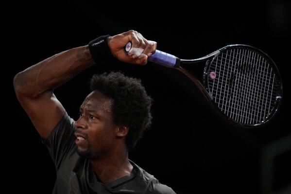Gael Monfils, of France, returns the ball during a match against Carlos Gimeno Valero, of Spain, at the Mutua Madrid Open tennis tournament in Madrid, Monday, May 2, 2022. (AP Photo/Bernat Armangue)