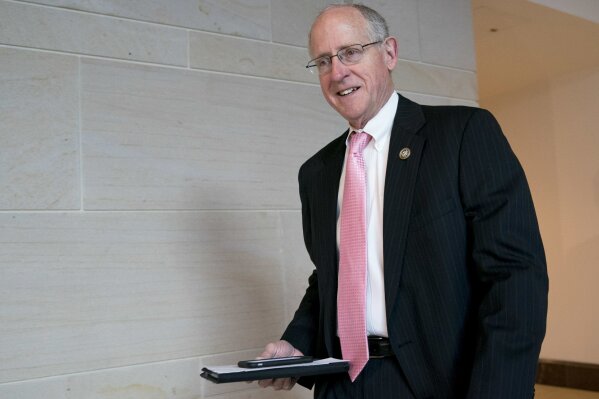 FILE - In this March 8, 2018, photo, Rep. Mike Conaway, R-Texas, walks at the Capitol in Washington.  Conaway became the eighth Republican lawmaker to announce he won’t seek re-election in 2020, which the 71-year-old attributed to his loss of a leadership role atop his beloved House Agriculture Committee. (AP Photo/Andrew Harnik, File)