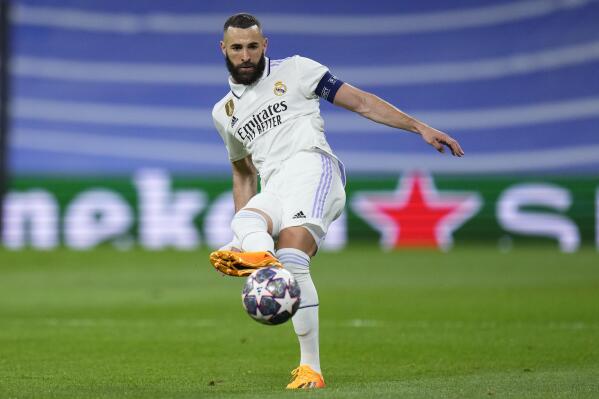 Real Madrid's Karim Benzema passes the ball during the Champions League semifinal first leg soccer match between Real Madrid and Manchester City at the Santiago Bernabeu stadium in Madrid, Spain, Tuesday, May 9, 2023. (AP Photo/Manu Fernandez)