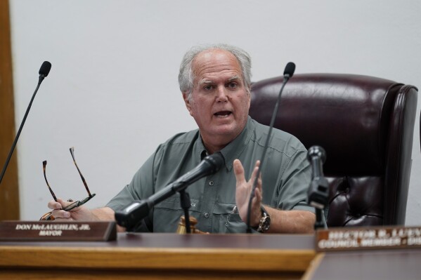 FILE -Uvalde Mayor Don McLaughlin, Jr., speaks during a special emergency city council meeting, Tuesday, June 7, 2022, in Uvalde, Texas, to reissue the mayor's declaration of a local state of disaster due to the recent school shooting at Robb Elementary School. Two teachers and 19 students were killed. A new investigative report that cleared all City of Uvalde police officers of wrongdoing in one of the deadliest classroom shootings in U.S. history surprised, Don McLaughlin the city’s former mayor, who said he believes the acting police chief on the scene should have been held accountable for his failures.(AP Photo/Eric Gay, File)