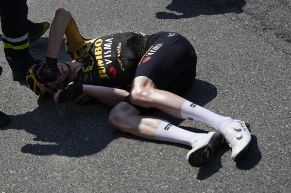 Belgium's Nathan van Hooydonck crashed during the fifteenth stage of the Tour de France cycling race over 179 kilometers (111 miles) with start in Les Gets Les Portes du Soleil and finish in Saint-Gervais Mont-Blanc, France, Sunday, July 16, 2023. (AP Photo/Daniel Cole)