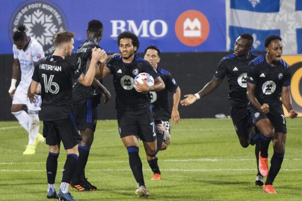 CF Montreal's Ahmed Hamdi (7) is congratulated after coring against FC Cincinnati during the second half of an MLS soccer match Saturday, July 17, 2021, in Montreal. (Graham Hughes/The Canadian Press via AP)
