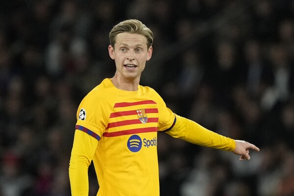 FILE - Barcelona's Frenkie de Jong gestures during the Champions League quarterfinal first leg soccer match between Paris Saint-Germain and Barcelona at the Parc des Princes stadium in Paris, Wednesday, April 10, 2024. Netherlands midfielder De Jong has been ruled out of the European Championship after failing to recover from an ankle injury, dealing a blow to the team's chances at the tournament that starts on Friday, June 14. (AP Photo/Lewis Joly, File)
