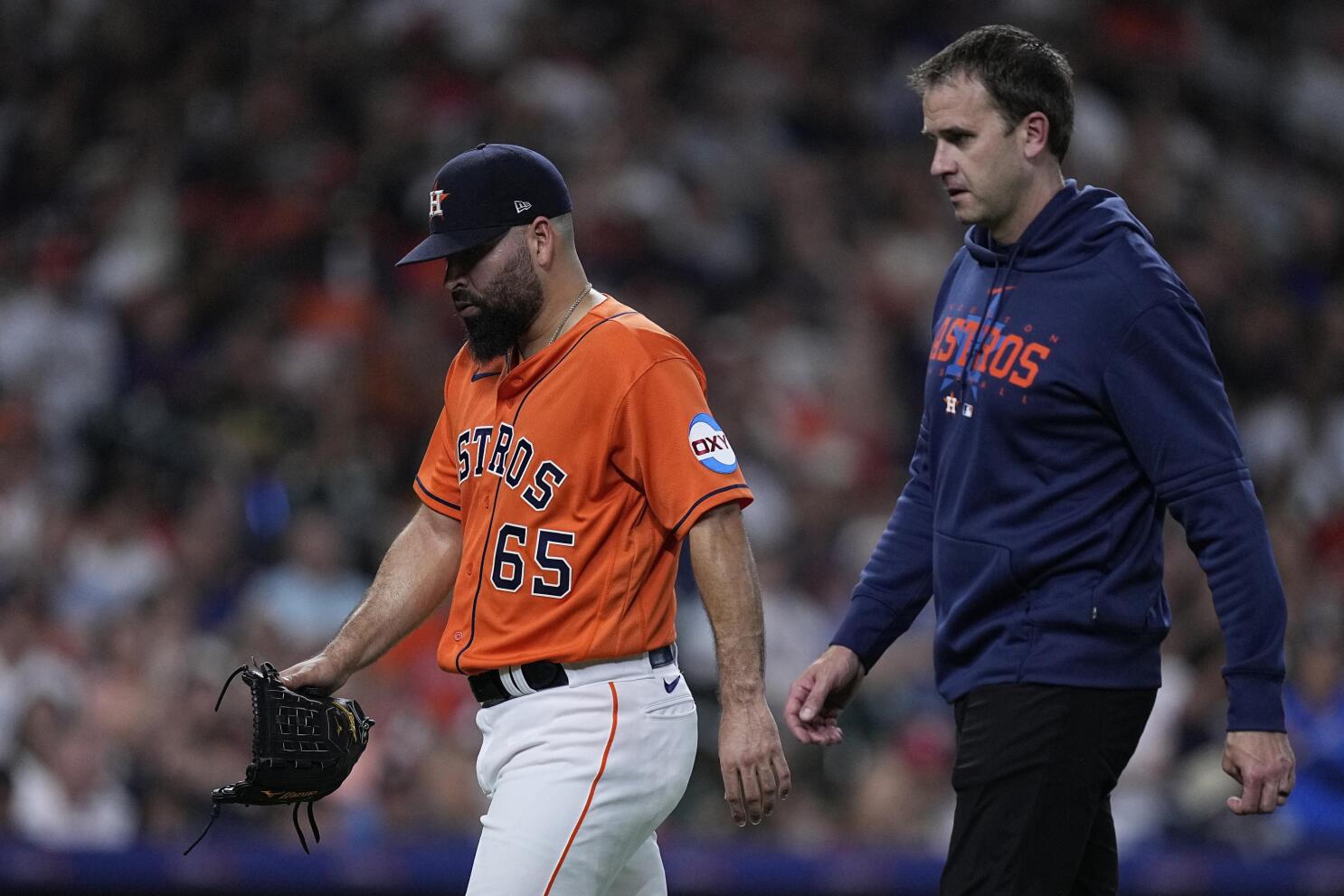 Houston Astros' Jose Urquidy (65) leaves the game during the