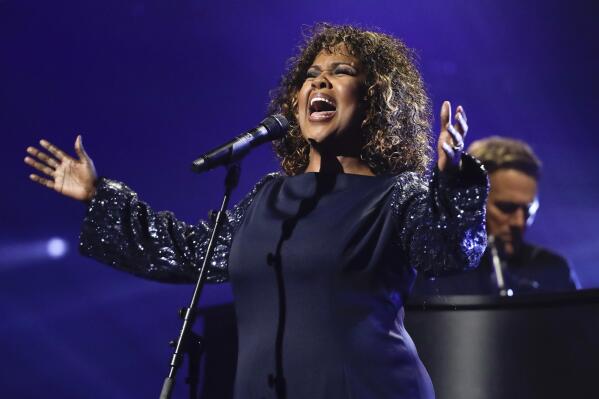 FILE - CeCe Winans performs during the Dove Awards on Tuesday, Oct. 15, 2019, in Nashville, Tenn. The 52nd annual Dove Awards are planned for Oct. 19 in Nashville, Tennessee, where the leading voices in gospel and worship music will be honored. (AP Photo/Mark Humphrey, file)