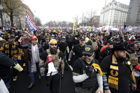 FILE - Supporters of President Donald Trump wearing attire associated with the Proud Boys attend a rally at Freedom Plaza, Dec. 12, 2020, in Washington. A judge on Friday, June 30, 2023, awarded more than $1 million to a Black church in downtown Washington, D.C. that sued the far-right Proud Boys for tearing down and burning a Black Lives Matter banner during a 2020 protest. (AP Photo/Luis M. Alvarez, File)