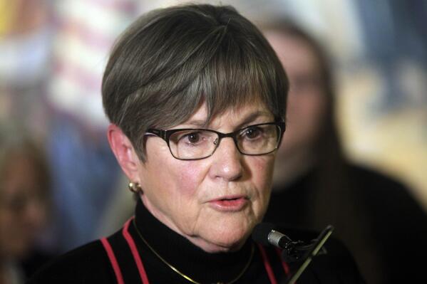 Kansas Gov. Laura Kelly speaks during a news conference with former Kansas Teacher of the Year winners, Tuesday, April 25, 2023, at the Statehouse in Topeka, Kan. As conservative Republican lawmakers promote school choice proposals, the Democratic governor says the state should not "divert" its tax dollars to private schools. (AP Photo/John Hanna)