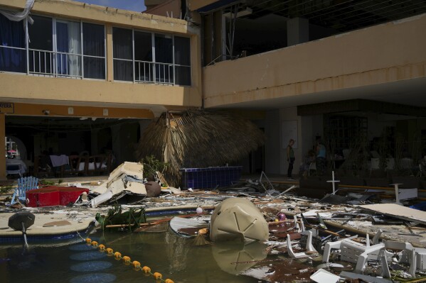 A hotel is strewn with debris after Hurricane Otis ripped through Acapulco, Mexico, Thursday, Oct. 26, 2023. The hurricane that strengthened swiftly before slamming into the coast early Wednesday as a Category 5 storm has killed at least 27 people as it devastated Mexico’s resort city of Acapulco. (AP Photo/Felix Marquez)
