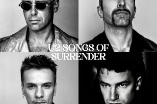 This image released by Universal shows "Songs of Surrender" by U2. (Universal via AP)