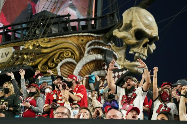 Fans cheer during the first half of the NFL Super Bowl 55 football game between the Tampa Bay Buccaneers and the Kansas City Chiefs, Sunday, Feb. 7, 2021, in Tampa, Fla. (AP Photo/Mark Humphrey)