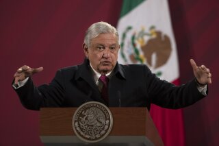 FILE - In this Dec. 18, 2020 file photo, Mexican President Andres Manuel Lopez Obrador gives his daily, morning news conference at the presidential palace, Palacio Nacional, in Mexico City. Lopez Obrador vowed Thursday, Jan. 14, 2021 to lead an international effort to combat what he considers censorship by social media companies that have blocked or suspended the accounts of U.S. President Donald Trump. (AP Photo/Marco Ugarte, File)