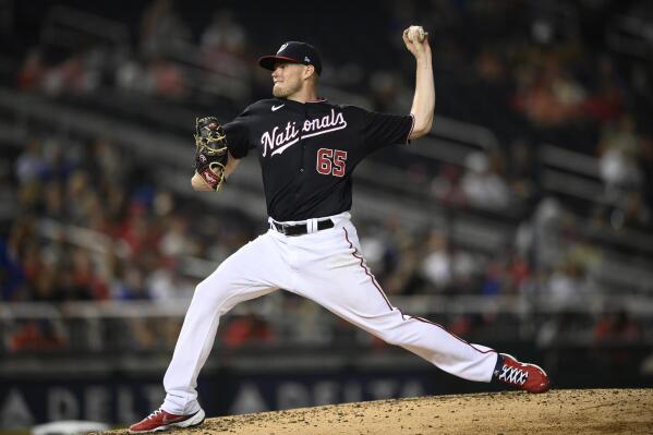 Washington Nationals starting pitcher Josh Rogers (65) delivers during the fourth inning of the second baseball game of a doubleheader against the New York Mets, Saturday, Sept. 4, 2021, in Washington. The Nationals won 4-3. (AP Photo/Nick Wass)
