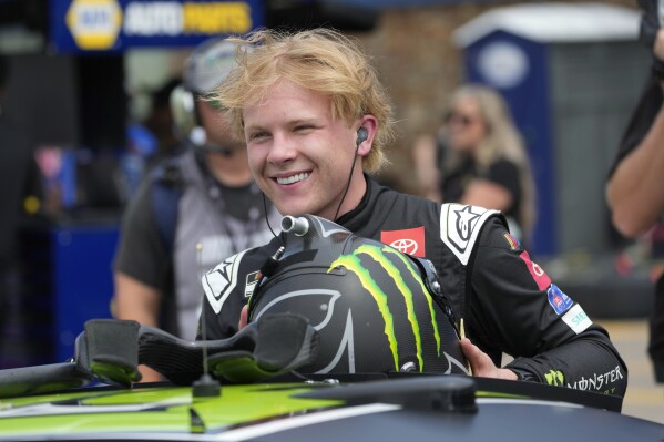 Ty Gibbs smiles during qualifications for a NASCAR Cup Series auto race at Michigan International Speedway in Brooklyn, Mich., Saturday, Aug. 5, 2023. (AP Photo/Paul Sancya)