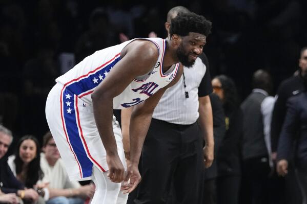 Philadelphia 76ers' Joel Embiid reacts after being hurt during the second half against the Brooklyn Nets in Game 3 of an NBA basketball first-round playoff series Thursday, April 20, 2023, in New York. (AP Photo/Frank Franklin II)