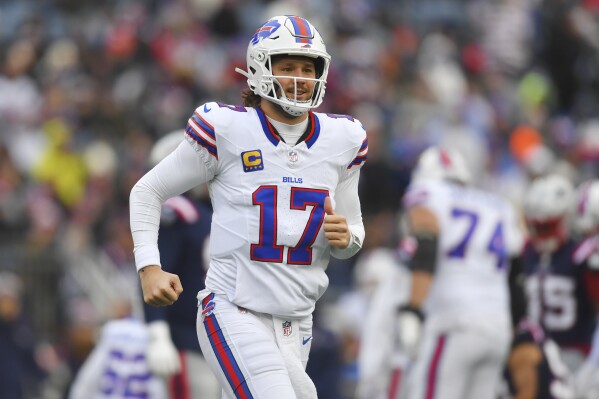 Buffalo Bills quarterback Josh Allen (17) smiles while coming out of the game during the first half of an NFL football game against the New England Patriots, Sunday, Jan. 5, 2025, in Foxborough, Mass. (AP Photo/Steven Senne)