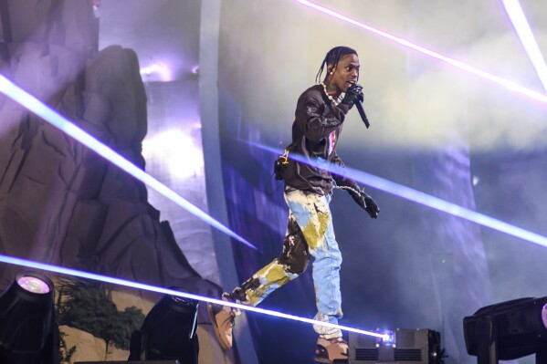 FILE - Travis Scott performs at Astroworld Festival at NRG park on Friday, Nov. 5, 2021, in Houston. A judge has declined to dismiss hundreds of lawsuits filed against rap star Scott over his role in the deadly 2021 Astroworld festival in which 10 people were killed in a crowd surge. State District Judge Kristen Hawkins issued a one-page order made public Wednesday, April 24, 2024, denying Scott’s request to be dropped from the case. (Jamaal Ellis/Houston Chronicle via AP, File)