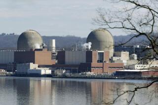 FILE - This Feb. 28, 2017, file photo shows Indian Point Energy Center in Buchanan, N.Y. The 1,020-megawatt Unit 2 reactor at the Indian Point Energy Center along the Hudson River will close for good Thursday, April 30, 2020 and 1,040-megawatt Unit 3 will close in April 2021, as part of a deal reached in January 2017 between Entergy Corp., the state of New York and the environmental group Riverkeeper.  (AP Photo/Seth Wenig, File)