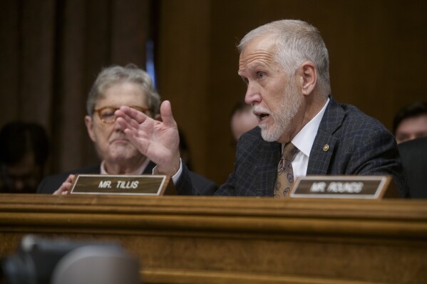 Sen. Thom Tillis, R-N.C., questions Eric Scott Turner, President-elect Donald Trump's nominee to be Secretary of Housing, at a Senate Committee on Banking, Housing, and Urban Affairs hearing for his pending confirmation on Capitol Hill, Thursday, Jan. 16, 2025, in Washington. (AP Photo/Rod Lamkey, Jr.)