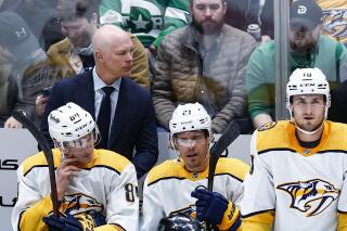Nashville Predators head coach John Hynes looks on during the first period of an NHL hockey game against the Dallas Stars, Wednesday, Feb. 9, 2022, in Dallas. Dallas won 4-3. (AP Photo/Brandon Wade)