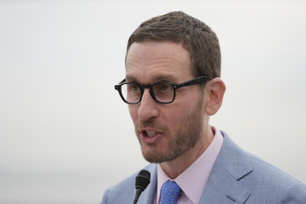 California State Senator Scott Wiener speaks during a news conference in San Francisco, Friday, Jan. 26, 2024. Business and agricultural groups sued California Tuesday, Jan. 30, 2024, over the most sweeping climate disclosure mandates in the nation, arguing they overstep on the federal government's authority to regulate emissions nationwide. Sen. Wiener authored a law requiring companies making more than $1 billion annually and do business in California to disclose their direct and indirect greenhouse gas emissions. (AP Photo/Eric Risberg)