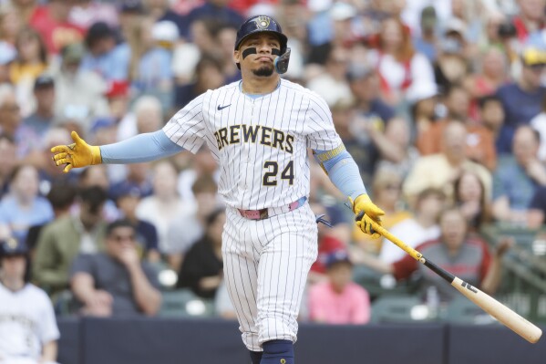 Milwaukee Brewers' William Contreras reacts after striking out against the St. Louis Cardinals during the fourth inning of a baseball game, Saturday, June, 14, 2025, in Milwaukee. (AP Photo/Jeffrey Phelps)