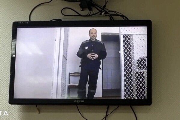 In this photo taken from video released by Russian independent news outlet SOTA Telegram channel, Russian opposition activist Vladimir Kara-Murza appears in a video feed from a Siberian penal colony on Thursday, Feb. 22, 2024. The video was beamed by the Russian Federal Penitentiary Service to a hearing at the Zamoskvoretsky court in Moscow on allegations by Kara-Murza. In the video, Kara-Murza urged Russians to keep fighting for democracy despite the death of Alexei Navalny in prison. (Russian independent news outlet SOTA telegram channel via AP)
