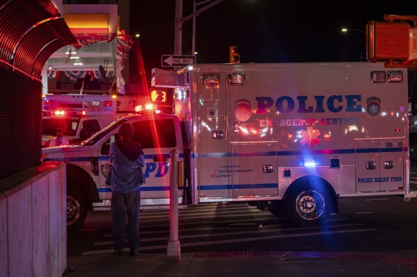 A New York City Police Department ambulance carrying the remains of Officer Jonathan Diller drives out from under Jamaica Hospital Medical Center in New York, late Monday, March 25, 2024. Diller was shot and killed during a traffic stop, Mayor Eric Adams said. (AP Photo/Jeenah Moon)